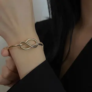 Infinity Knot Bracelet - Gold Finish with Interlocking Design, Elegant and Unique Accessory for Everyday Wear