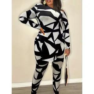 A set of long sleeved tops and trousers with geometric print slit hems