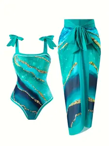 Marble Print One-Piece Swimsuit with Matching Cover-Up Skirt Teal marble print swimsuit with bow shoulder straps, paired with a matching tied-waist cover-up skirt Summer Vibes