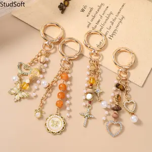 2026 New Arrival: Best-Selling Beaded Keychain & Bag Charm — Featuring Round Disc, Cross, Butterfly, and Heart Pendants