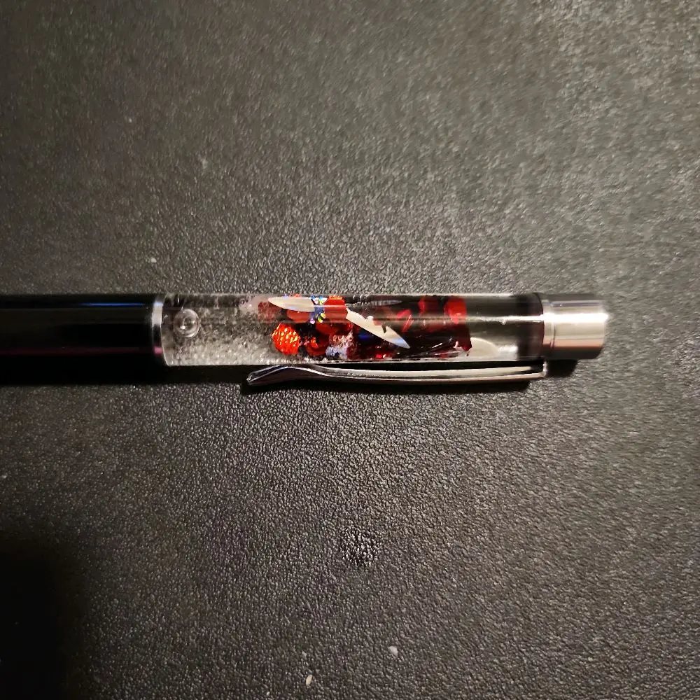 Halloween Themed Fidget Pen with Clear Body and Red Accents for Stress Relief and Fun Writing