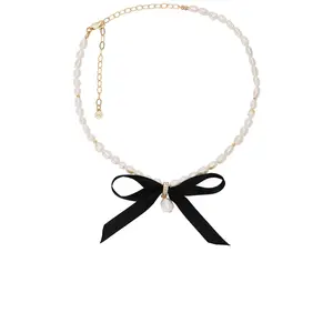 Ettika Velvet Bow Statement Pearl Choker in Black