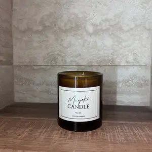Muyoki Candle with notes of bergamot, coconut, sandalwood, saffron scented obsessed