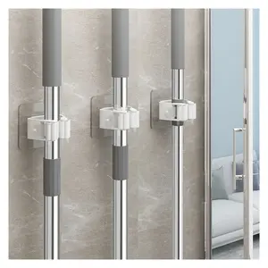 4-Pack Self Adhesive Broom Holder Wall Mount - Heavy Duty No Drill Broom Organizer for Garage Closet Kitchen, Plastic Storage Rack for Brooms Mops Tools, Peel and Stick Adhesive, White closet laundry room broom holder wall mount broom storage rack