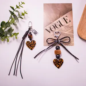 New leopard print love keychain pendant creative weaving double-layer bow hairball beaded bag pendant