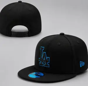 Los Angeles Dodgers New Era 9FORTY Snapback Baseball Cap – Black, flat brim, white LA logo and commemorative badge on the side, MLB streetwear accessory.