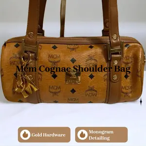 Pre-owned MCM Leather Shoulder Bags shoulder bag in cognac Visetos with gold hardware and charm.
