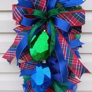 Nutcracker Swag with Festive Plaid Bow and Glitter Ornaments for Holiday Decor