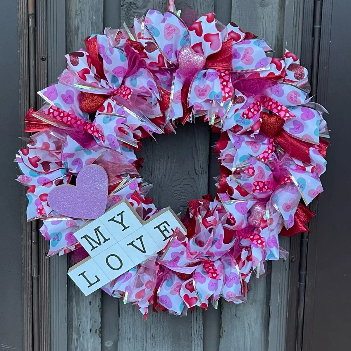 Pink and Red Valentine Wreath with Heart and "MY LOVE" Design, Decorative Elements, and Colorful Accents