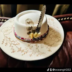 Introducing the “Bristol Bay”  Cream color floral- the band can be customized or ordered just like or it is.  Under the brim can be personalized with a name, you’re, lyrics from a song, etc.  Ize is adjustable inside for your perfect fit.