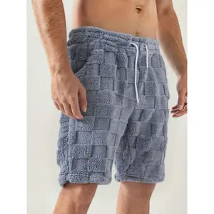 Men’s fall fleece shorts with a chessboard pattern, elastic waistband, and old-money side seam pockets—casual, versatile fleece shorts that are an essential part of any man’s wardrobe.
