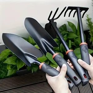 A Set of Four Outdoor Gardening Tools Including a Small Shovel for Planting Flowers, a Five-Pronged Rake, a Double-Headed Rake Garden Equipment