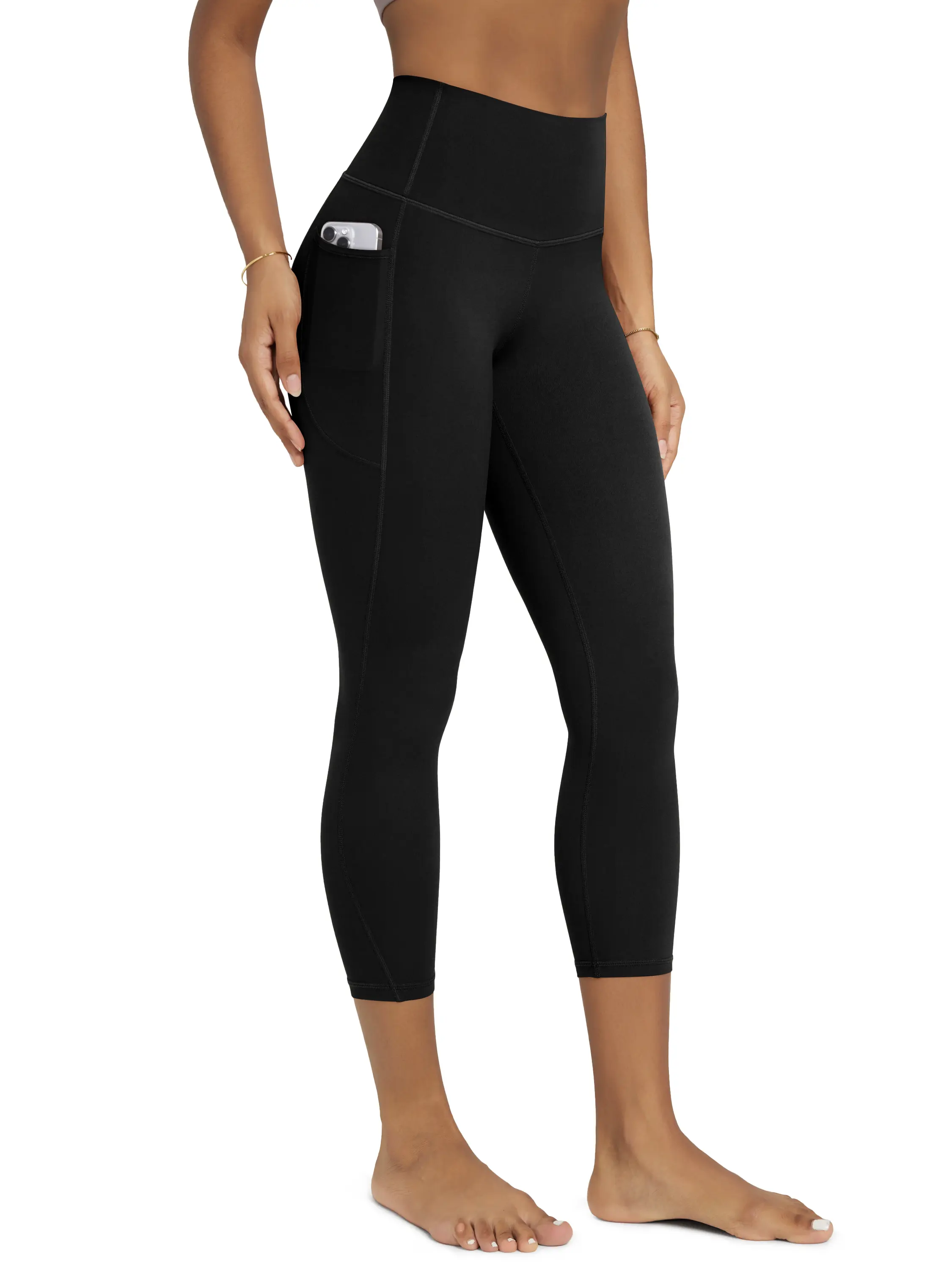 ODODOS Women's Buttery Soft Plain Weightless High-Waisted Leggings, 23" Gym Yoga Pants with Pockets, Gymwear Activewear for Lounge & Yoga