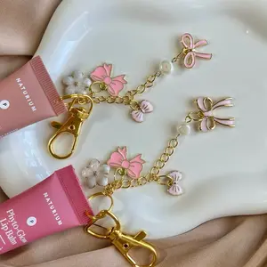 Hand Made Coquette Lip Gloss Keychain Charms with Pink Bow & Pearl Accents for Stylish Keyrings