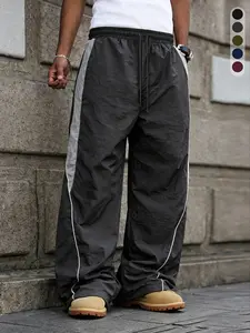 Men’s casual breathable pants, 100% polyester; comfortable street/Instagram style; retro straight-leg striped long pants; suitable for all seasons; loose wide-leg athletic pants; color-block wide-leg athletic pants.