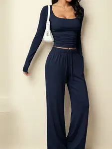 Two-piece set for women: square-neck long-sleeve cropped top and high-waisted slightly flared pants. Skin-friendly, highly elastic knit fabric. Ruched slim fit that flatters the figure. Casual sporty solid-color set suitable for everyday wear, commuting,