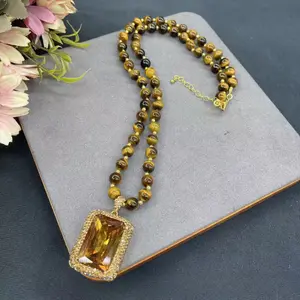 An Exquisite And Luxurious Tiger Eye Stone Pendant Necklace Plated In 14K Gold