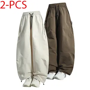 American retro solid color drawstring elastic waist pants with side zipper pockets and rear pocket, adjustable cuffs, ice silk fabric, loose long pants; men’s quick-dry breathable casual pants for everyday wear and outdoor sports; unisex design.