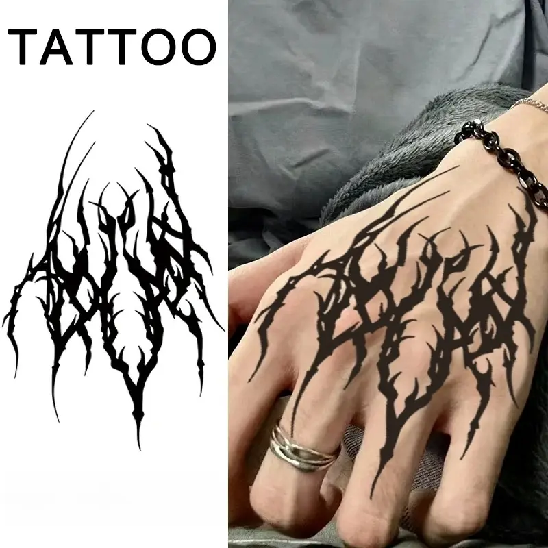 Temporary black tribal style tattoo with spikes, long columns, and back design, minimalist black tattoo