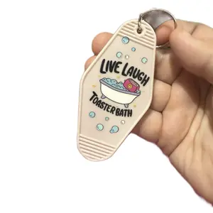 Light Pink Motel Keychain Live Laugh Toaster Bath Design with Fun Cartoon Illustration
