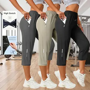 Women’s outdoor casual high-stretch capri pants with zippered pockets, loose straight cut, quick-dry fabric—suitable for everyday wear, commuting, strolling, and running across multiple scenarios.