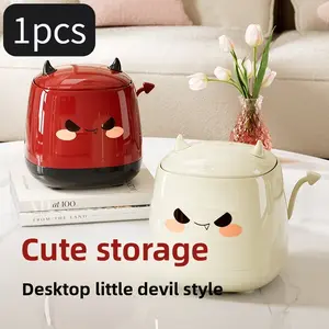 The desktop trash can with a push-down lid design and a locking function in the shape of a devil is a waste container suitable for home, office and bedroom decoration.