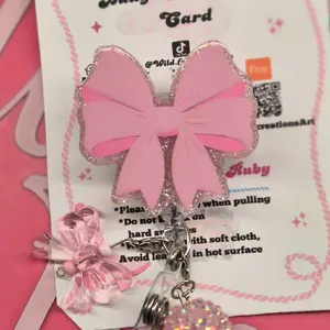 coquette bow badge reel