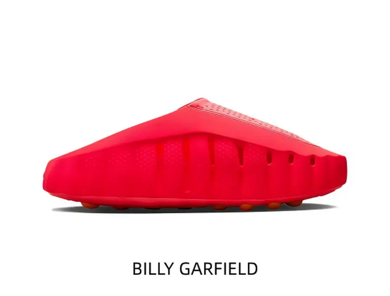 Low‑profile slip‑on chunky mule slides adopt vivid red sculpted one‑piece build, elevated platform base, warm orange rubber grip studs, seamless upper, no‑lace design for trendy everyday casual outfits.