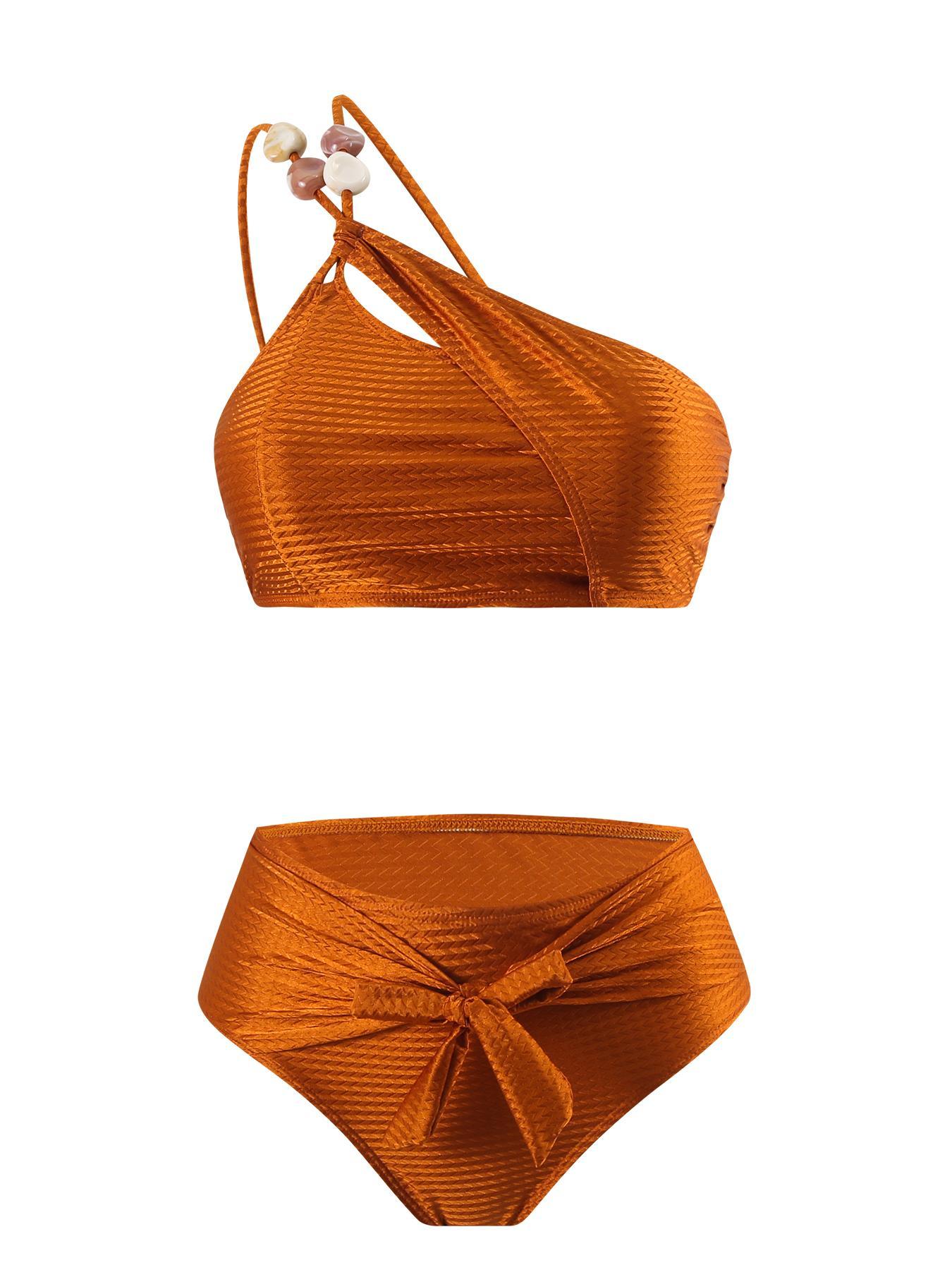 New European/American two-piece bikini swimsuit for women — sexy design with soft padding; three-piece set including a beach skirt, ideal for hot springs vacations.