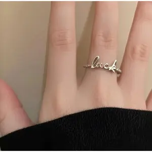 Lucky Script Ring – Minimalist Charm with Geometric Grace