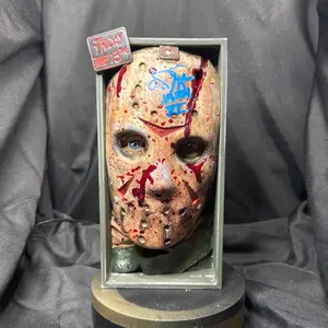 Jason Voorhees Collectible Mask with Blood Splatter and Iconic Friday the 13th Tag for Horror Fans