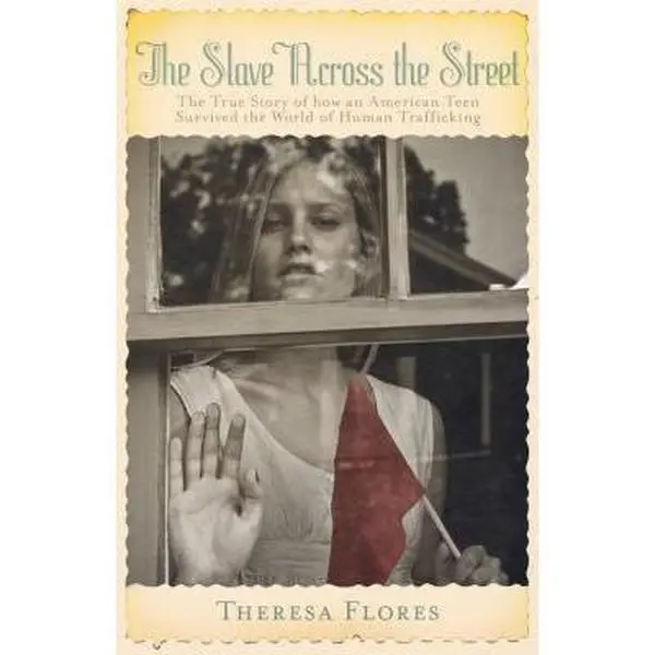 USED Book - The Slave Across the Street: The True Story of How an Amercian Teen Survived the World of Human Trafficking by Flores, Theresa L. (Paperback) - english