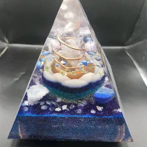 XL Orgone InnerG Pyramid with xl quartz point wrapped in copper inside a honey filled evil eye colored glow in the dark lotus flower plus more... for emf protection and grounding