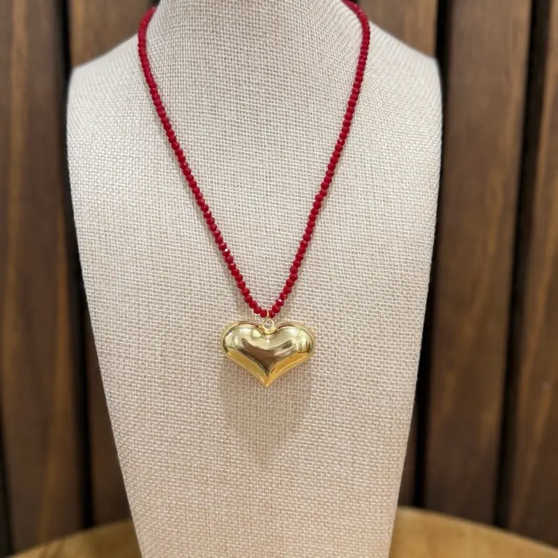 Spectacular bright red necklace with a large gold heart
