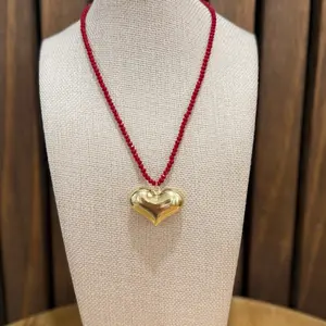 Spectacular bright red necklace with a large gold heart