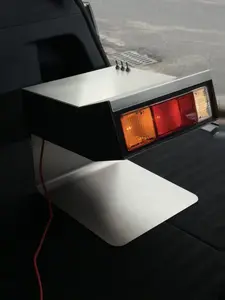 Old School Racing Tail Light Side Table, Luxury Automotive-Inspired Metal End Table, Collector-Grade Statement Furniture, Fingerprint-Resistant Steel Finish, Industrial Designer Bedside Nightstand, Garage Art Decor, High-End Racing Home Accent