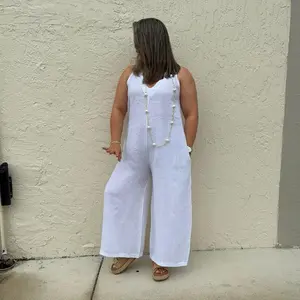 100 percent linen one size jumpsuit fits XS to ML wide leg linen jumpsuit with back bow detail side pockets breathable lightweight resort wear elegant relaxed fit ibiza style timeless minimal chic outfit for day to night comfortable airy natural fabric