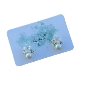 Auburn Earrings with Flower Design and Pearl Accents