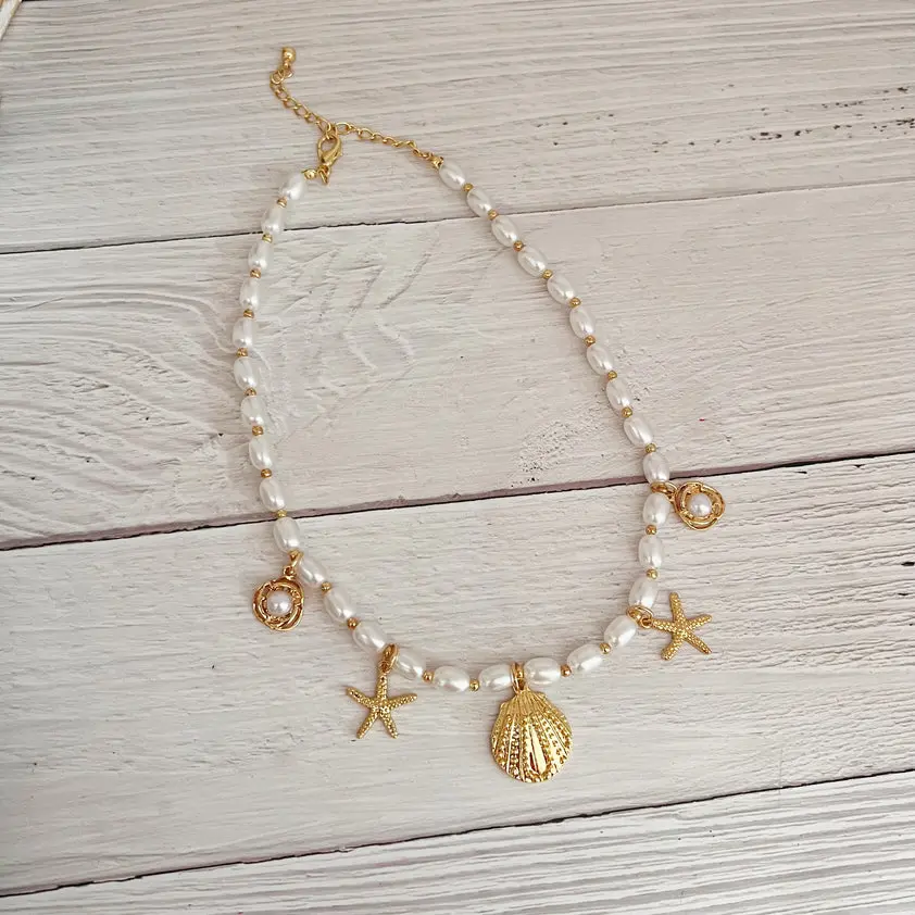 Beaded Faux Pearl Necklace with Gold Tone Shell Charm