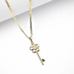 14 Karat Laminated Gold 2MM Key Shape Pendant Jewelry Necklace, Heart Shaped Pendant with Sparkling Center Stone, Elegant Costume Accessory for Daily Wear or Gifting