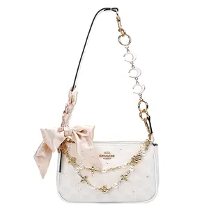 COACH Nolita 19 Small White Leather Shoulder Bag with Metal Logo and Rhinestone Accents