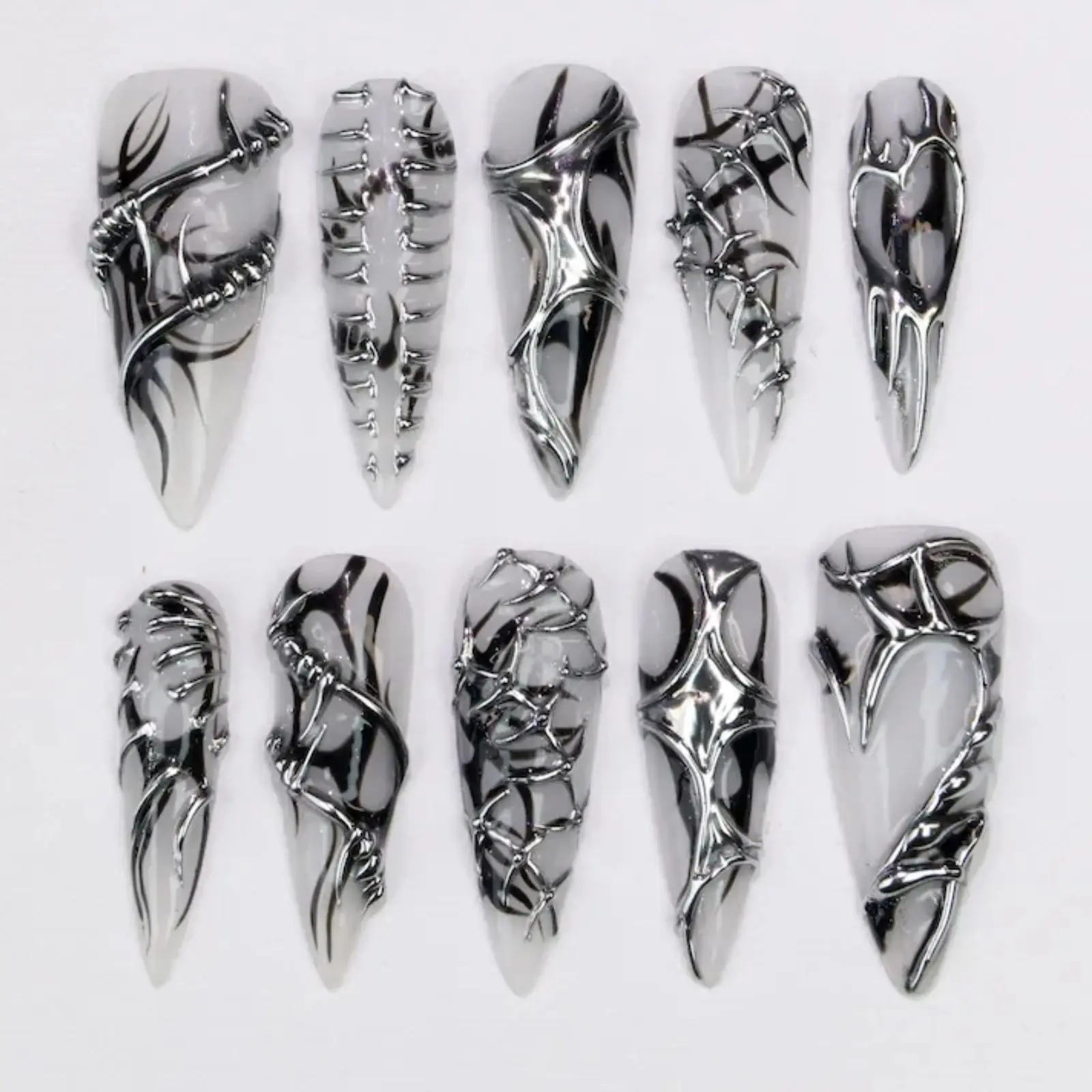 Futuristic Chrome Nails Art | 3D Nail Art | Sculptural Nail Designs | Metallic Statement Nails | Edgy Stiletto Nails | Cyber Y2K Nail Inspo