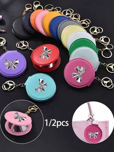 Candy-colored leather small round makeup mirror - with bow decoration, portable foldable travel mirror | Keychain and double-sided mirror pendant/bag charm, available in multiple colors | A must-have for students and commuters, stylish party gift