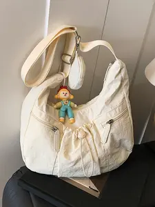 Cute, casual, fashionable and versatile crossbody tote bag with drawstring design and multiple zippered pockets, decorated with cartoon pendant ornaments. Comes with a small bag, suitable for short trips, outings, and commuting