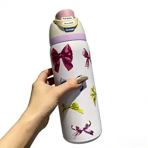 The Owala Freesip insulated cup features a white body with colorful bows. It has a capacity of 32 ounces and is made of 304 stainless steel. It comes with a straw and is suitable for various uses such as commuting, exercising, and working.