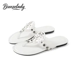 Women's White Cutout Thong Sandals, Open-Toe Flat Flip Flops with Decorative Ornament, Soft Faux Leather Upper, Cushioned Non-Slip Sole, Easy Slip-On Style for Summer Wear.