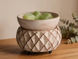 2-in-1 candle and fragrance warmer, compatible with scented candles and wax melts. Freshens indoor air, features cream and gold lattice design.