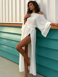 Two-piece women's white loose short-sleeved diagonal off-shoulder long-sleeve sun-protection top slit long dress set suitable for spring and summer, suitable for travel and vacation wear.