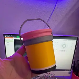 Yellow Bucket with Pink Lid and Gray Handle for Storage and Organization