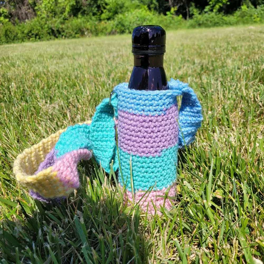 Crochet Water Bottle Holder fit for outside use. Stay hydrated on hikes, the beach, and even in the office or at home